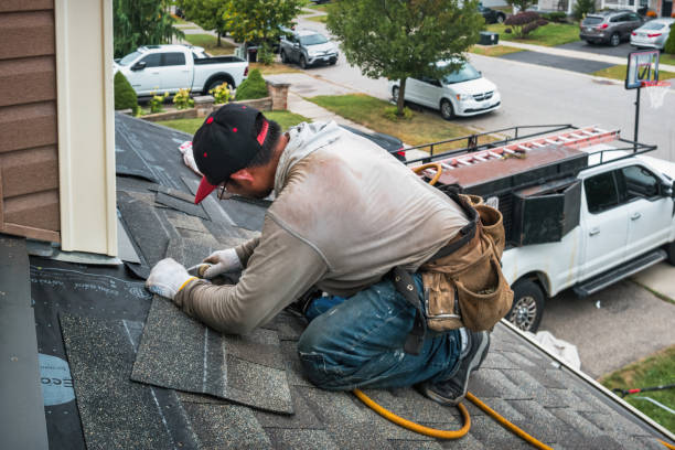 Professional Roofing technician working in Penfield, NY